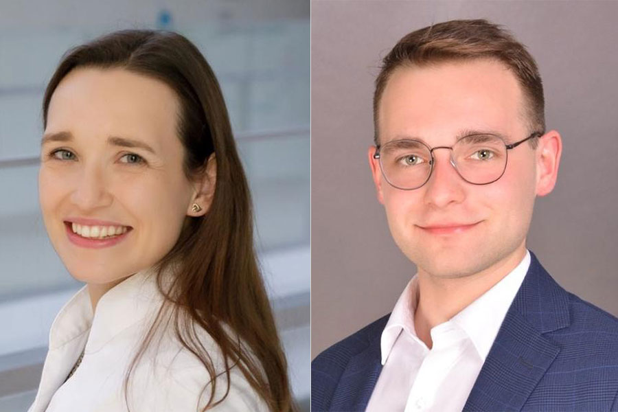 On the left, a young woman in a white blouse with her hair loose, smiles at the camera. On the right, a young man in a white shirt and navy blue jacket and glasses, smiles at the camera.