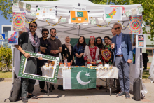 Pakistan stand. A dozen or so people. Most in folk costumes.