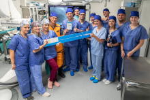 Group photo of a team of doctors in the operating room.